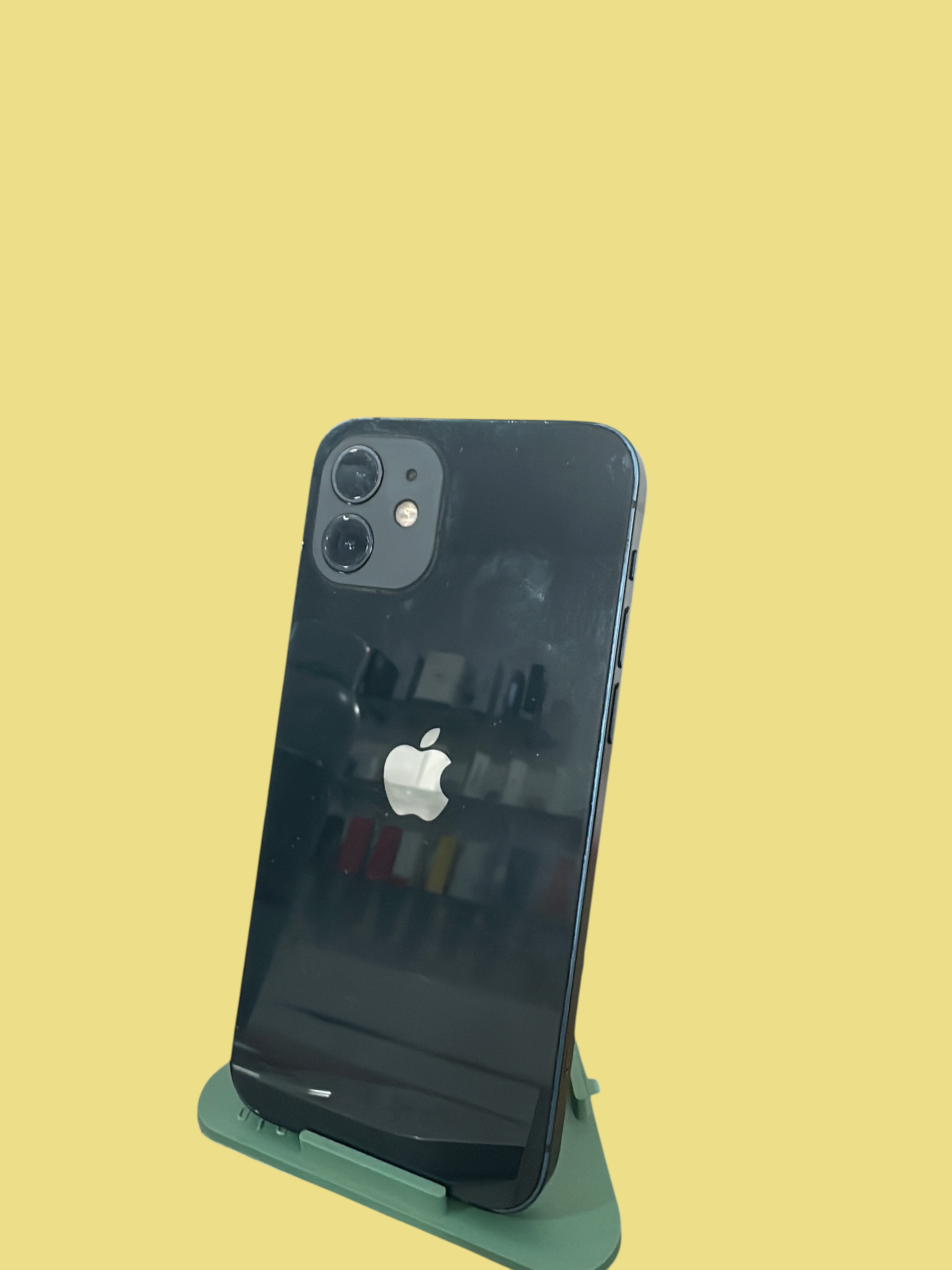 Iphoneio Official Apple iPhone 12 smartphone in black with a dual-camera system and sleek flat-edge design