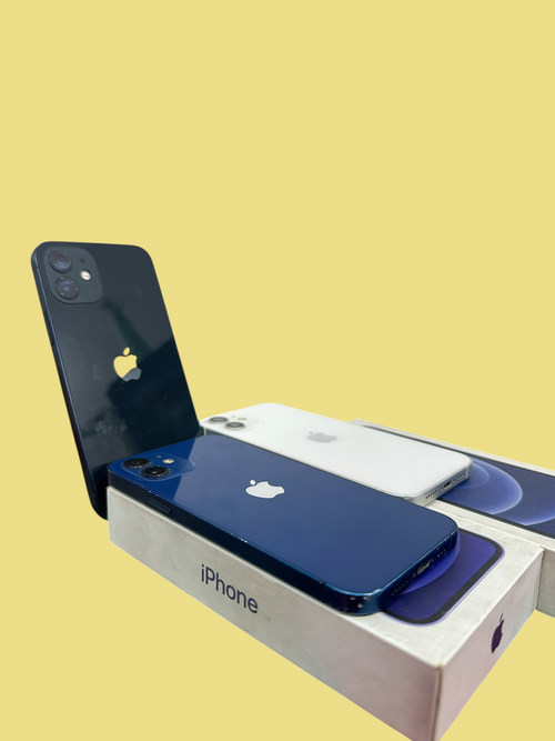 Iphoneio Official Apple iPhone 12 smartphones in blue and white resting on their original retail boxes