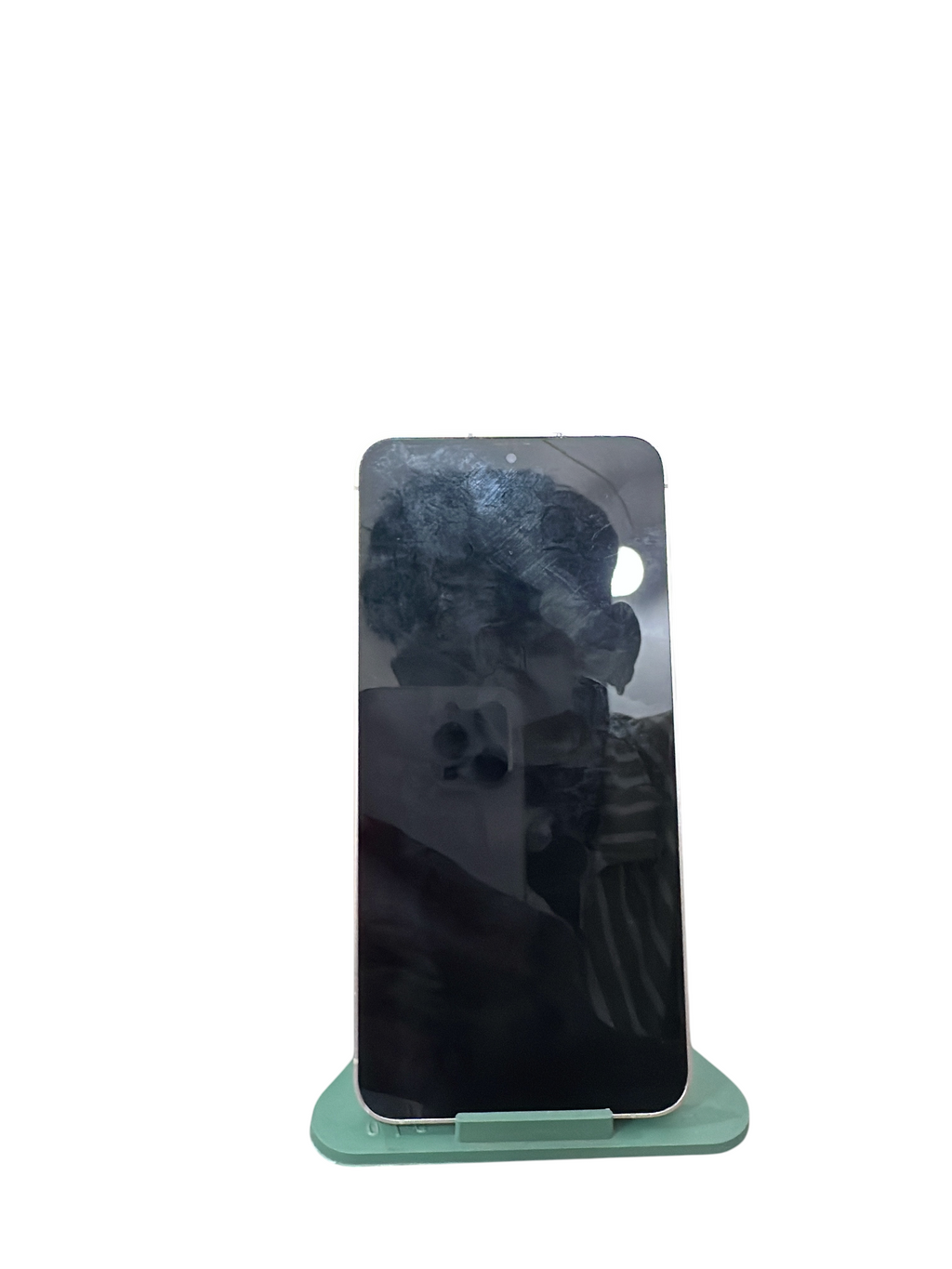 Iphoneio Official cream Samsung Galaxy smartphone with a sleek flat-edge frame displayed on a light green stand.