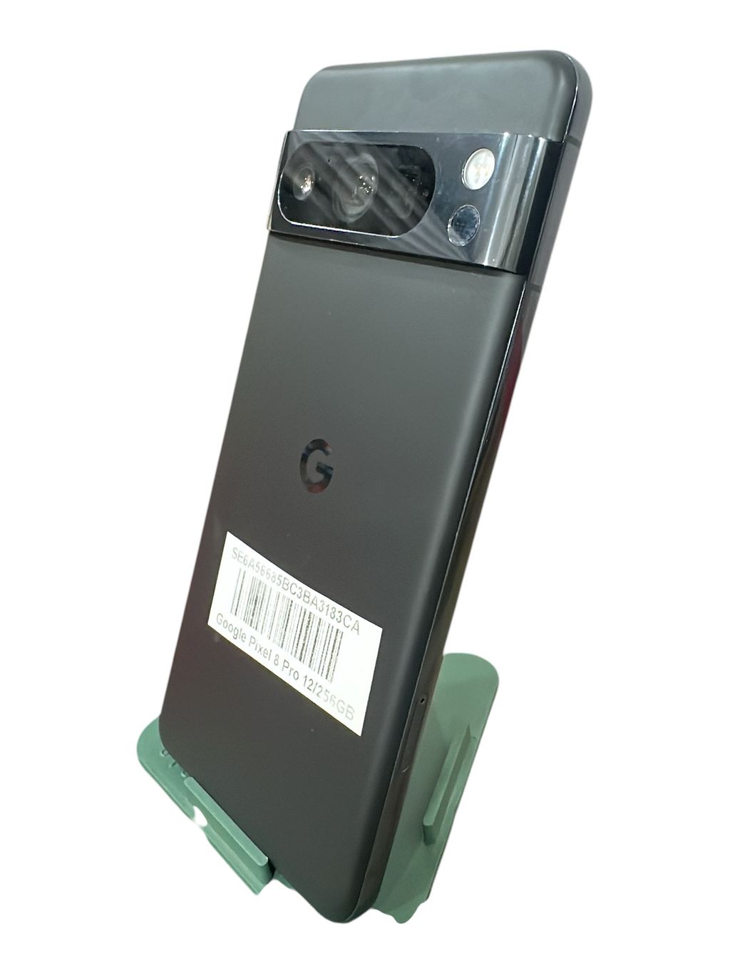 Iphoneio Official Google Pixel 8 Pro smartphone in matte black with iconic camera bar on a green display stand