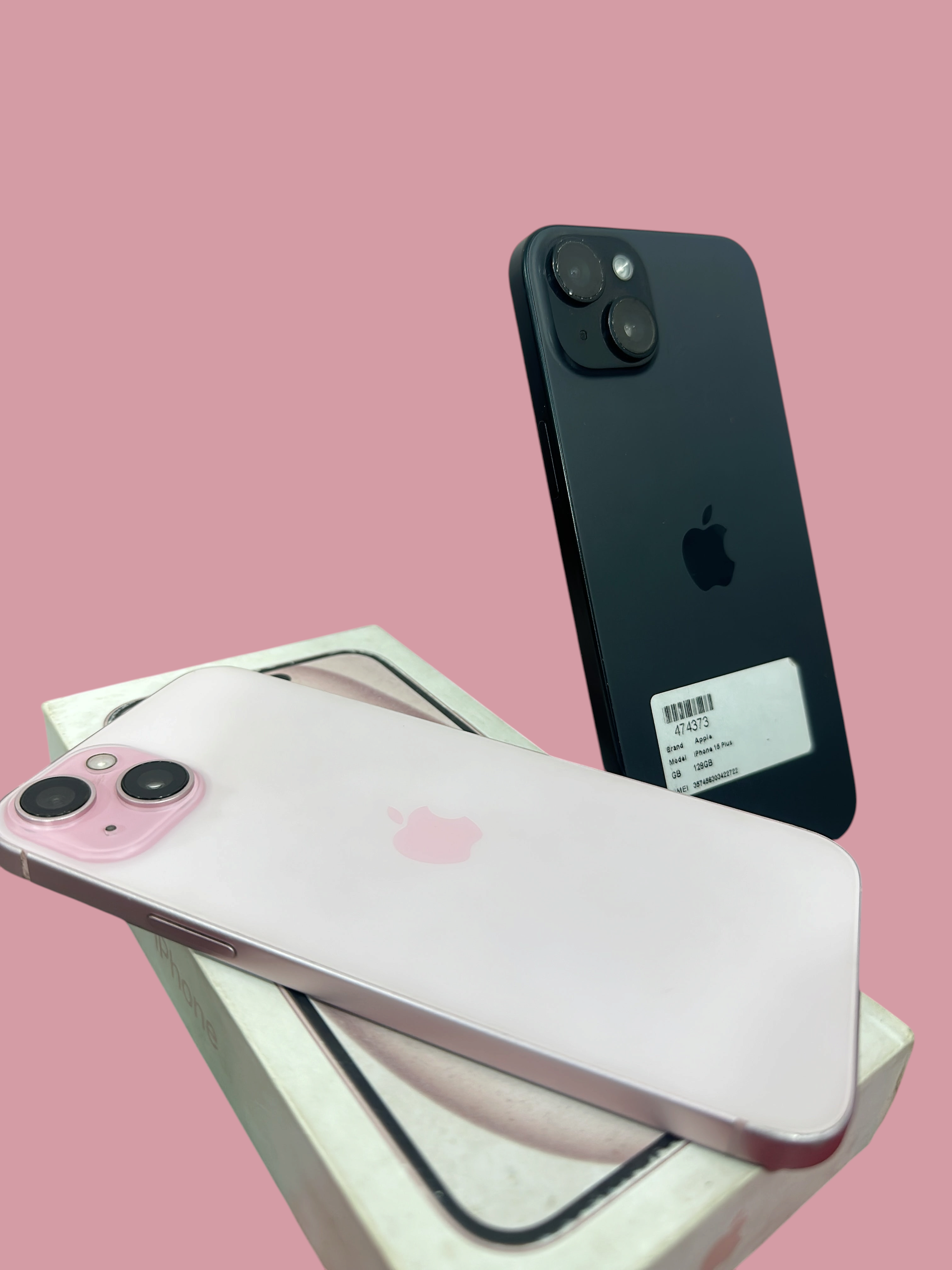Iphoneio Official Apple iPhone 15 Plus smartphones in pink and black with dual-camera systems on a white box