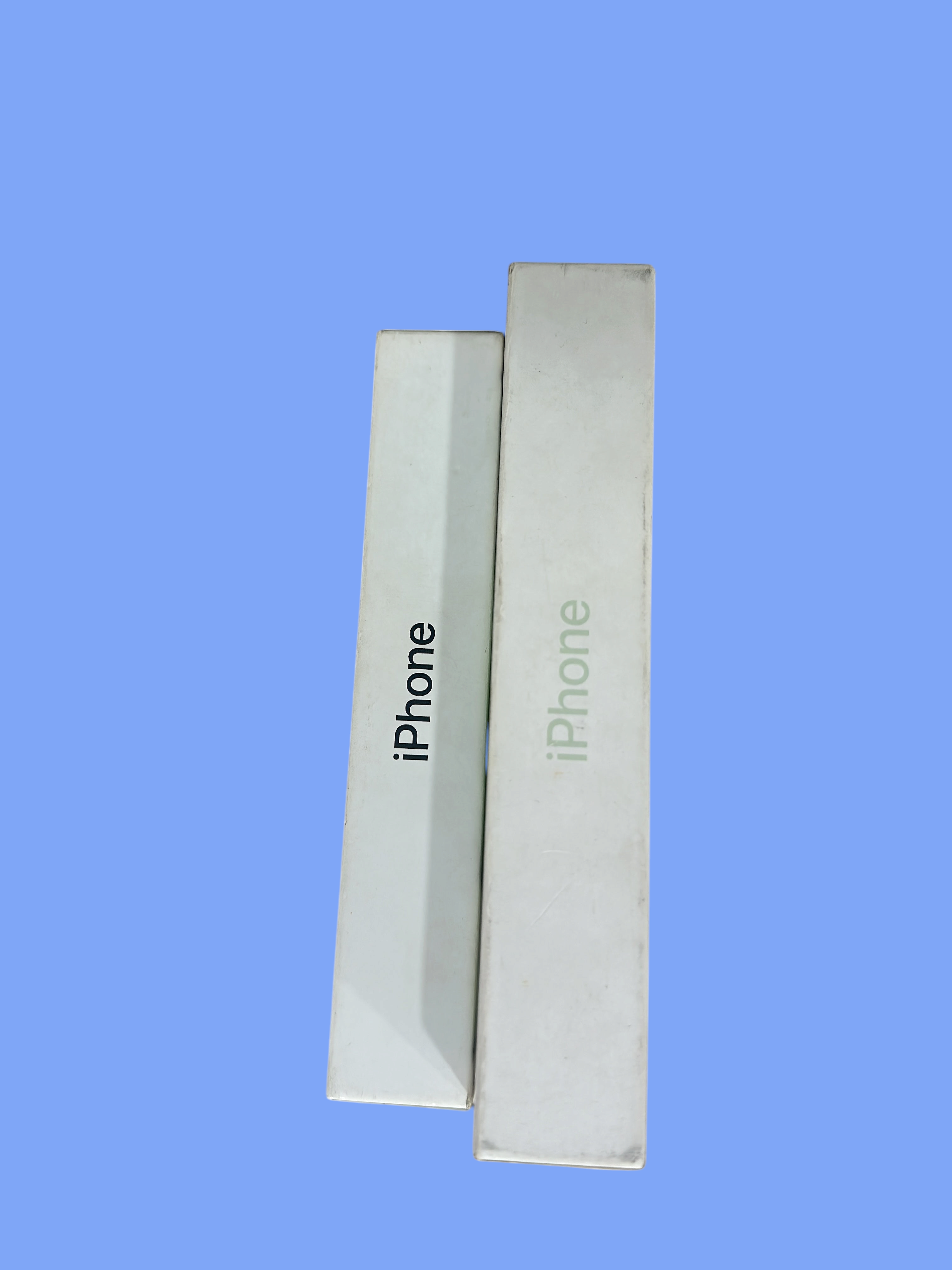 Iphoneio Official smartphone packaging boxes in white with iPhone branding on a black background