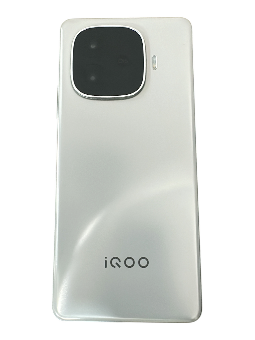 Iphoneio Official iQOO smartphone in pearlescent white with a prominent rear camera module on a textured surface
