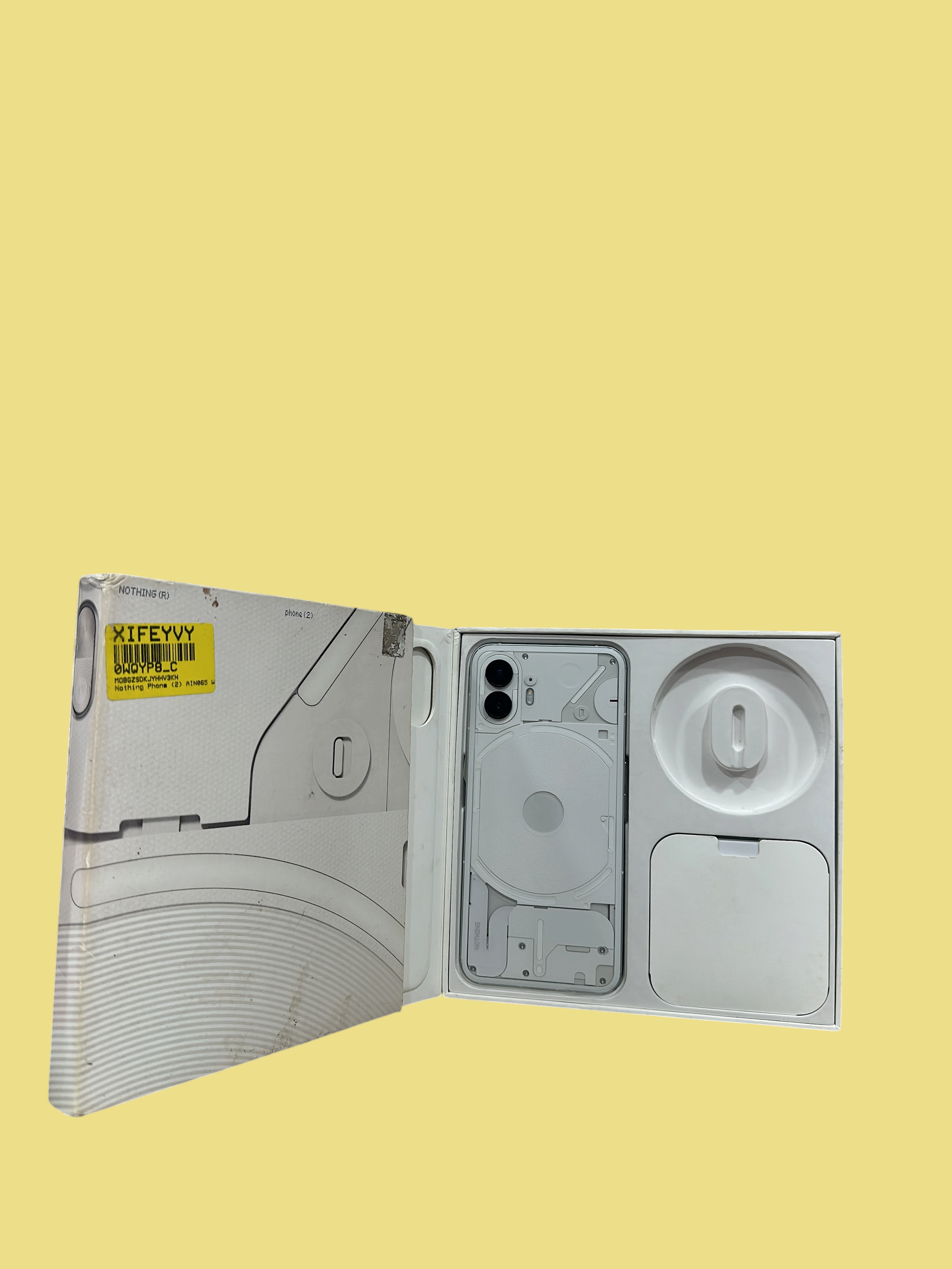 Iphoneio Official Nothing Phone 2 white smartphone in its original packaging with a transparent back design
