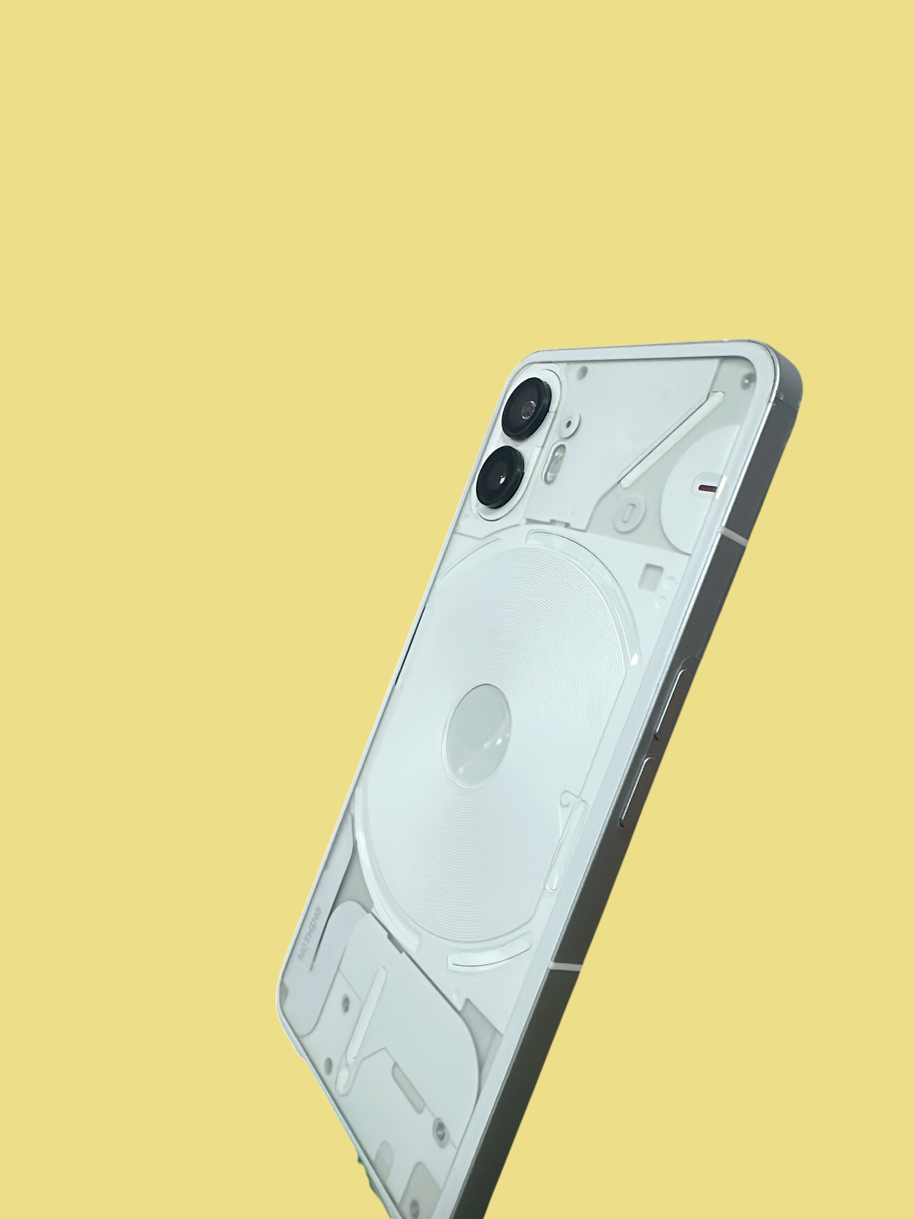 Iphoneio Official Nothing Phone 2 in white with a transparent back design and dual camera system