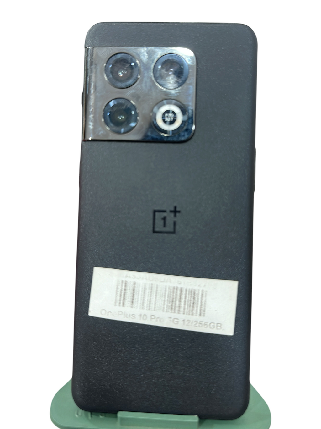 Iphoneio Official OnePlus 10 Pro 5G smartphone in matte black with a triple camera system on a green stand