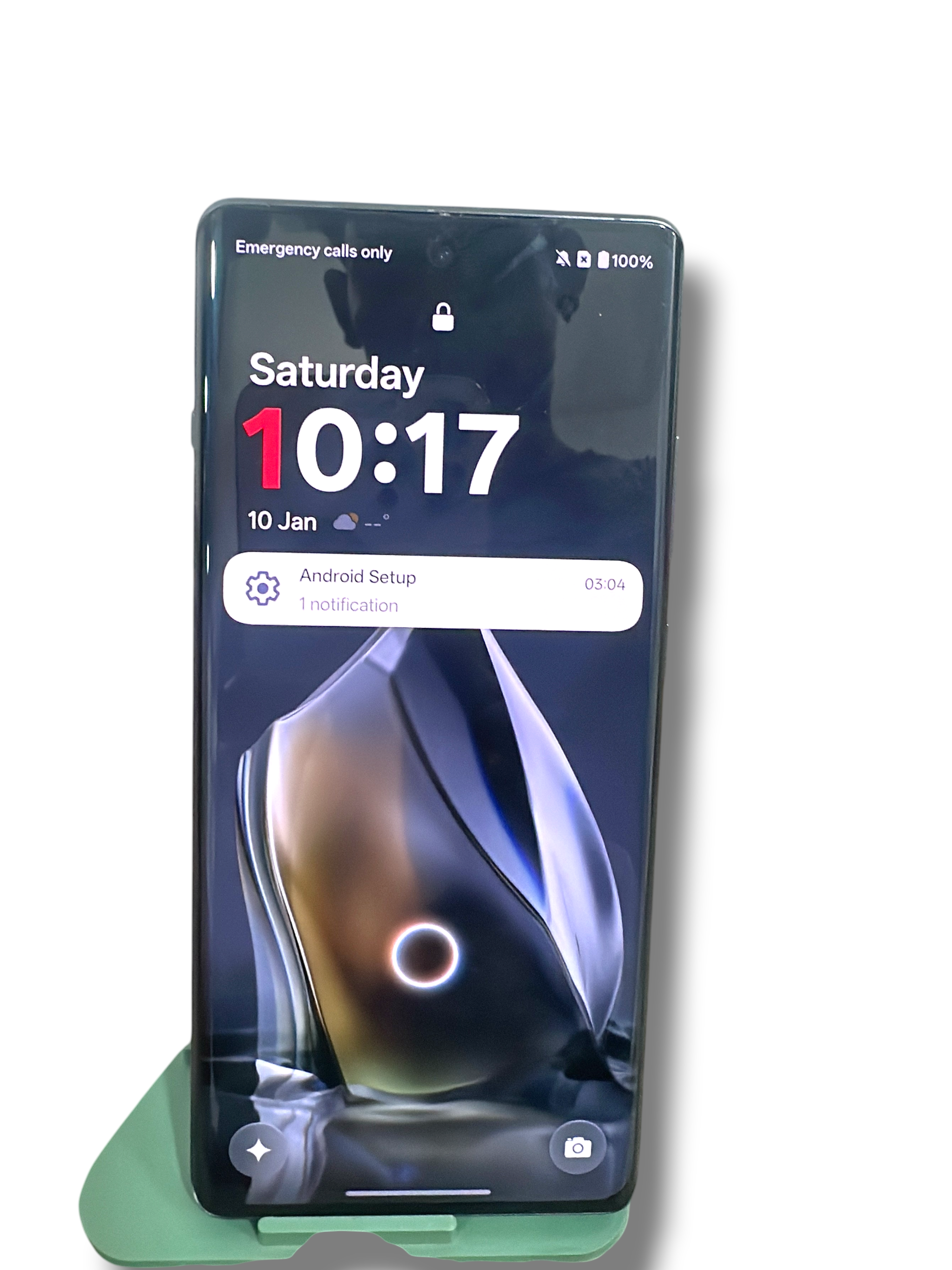 Iphoneio Official OnePlus 12R smartphone with a vibrant high-resolution display showing the lock screen and clock.
