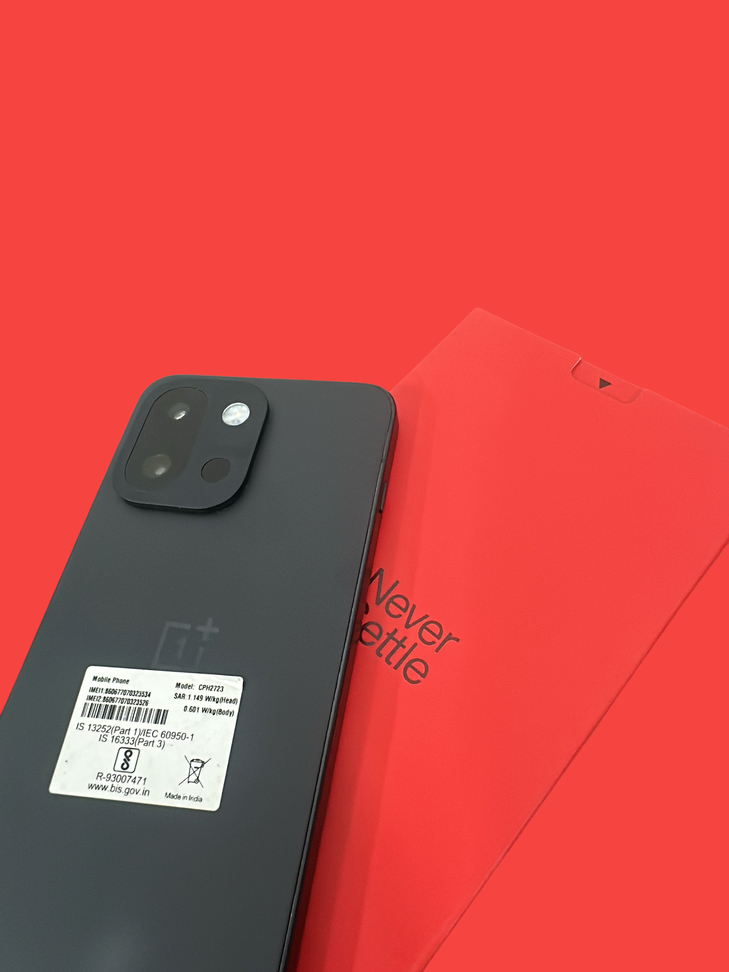 Iphoneio Official OnePlus Nord CE4 smartphone in matte charcoal with a red box featuring the Never Settle slogan