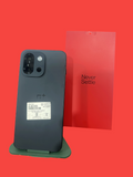 Iphoneio Official OnePlus Nord CE4 smartphone in matte charcoal with a red Never Settle box on a green stand