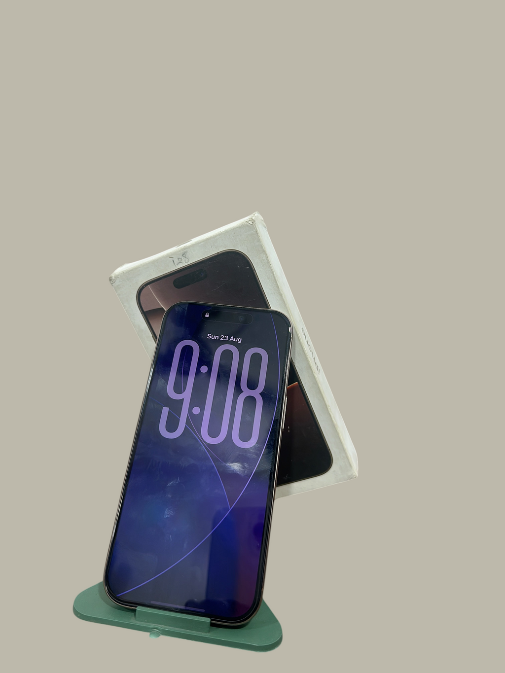 Iphoneio Official premium smartphone with edge-to-edge display showing time on a green stand against black background