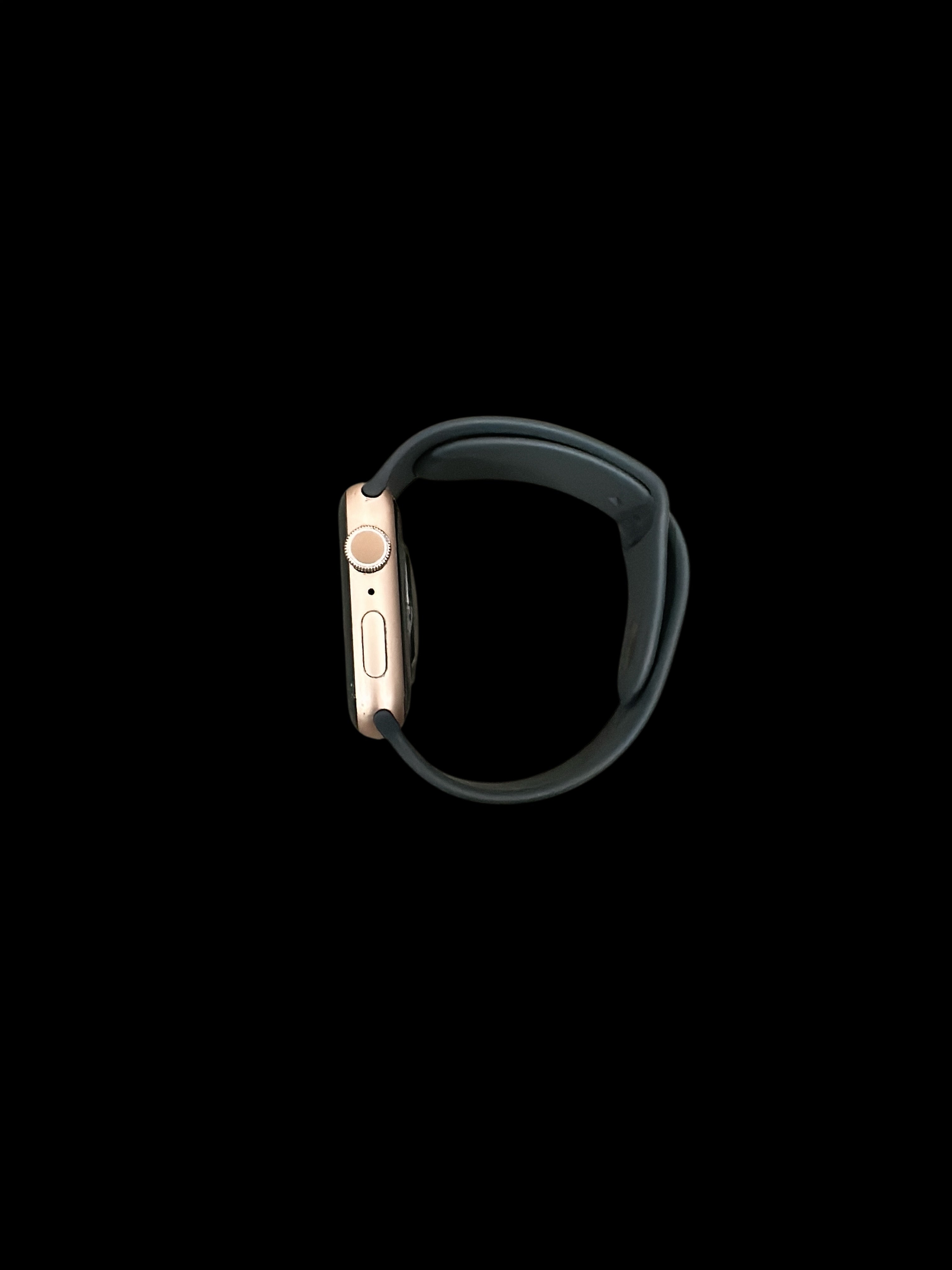 Iphoneio Official premium smartwatch with a rose gold case and dark grey silicone band, side profile view.