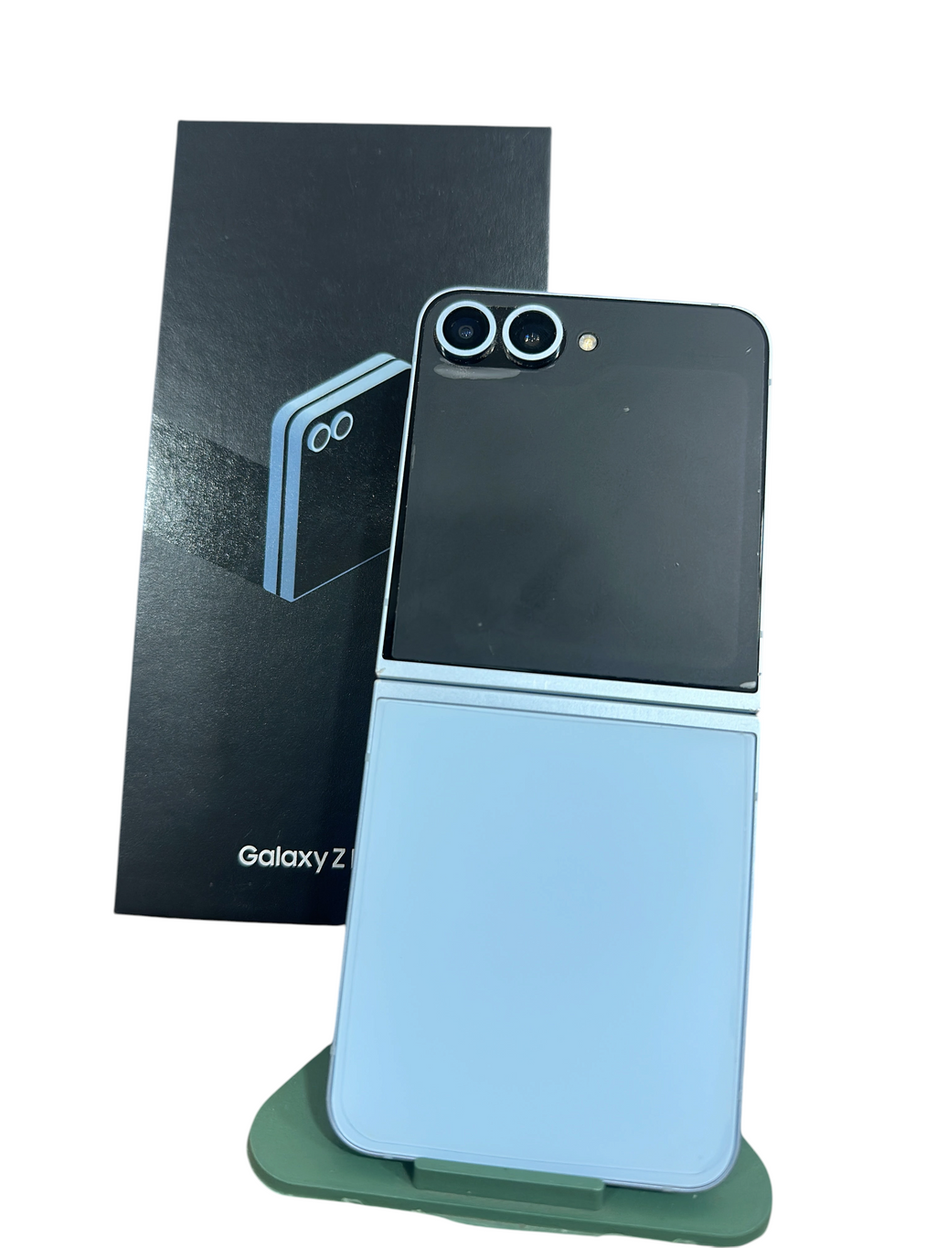 Iphoneio Official Samsung Galaxy Z Flip6 foldable smartphone in light blue with dual camera system and retail box