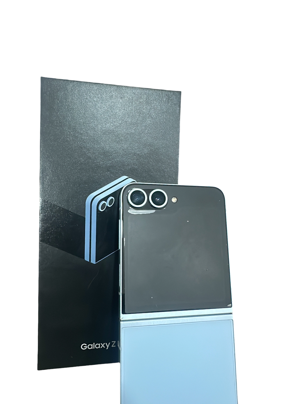 Iphoneio Official Samsung Galaxy Z Flip6 light blue foldable smartphone with dual camera standing against its box