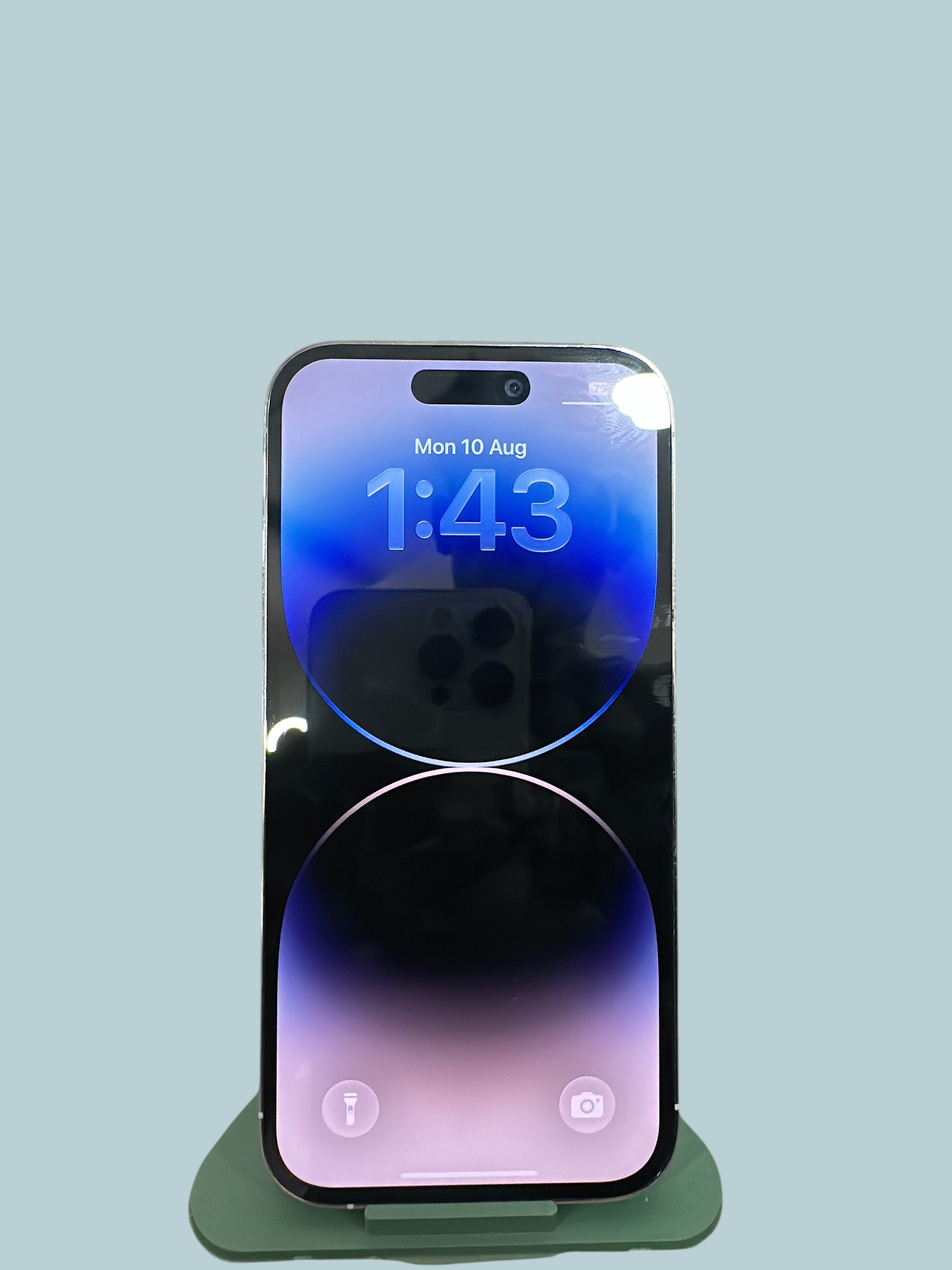 Iphoneio Official premium silver smartphone with a high-resolution display showing a blue and purple gradient wallpaper