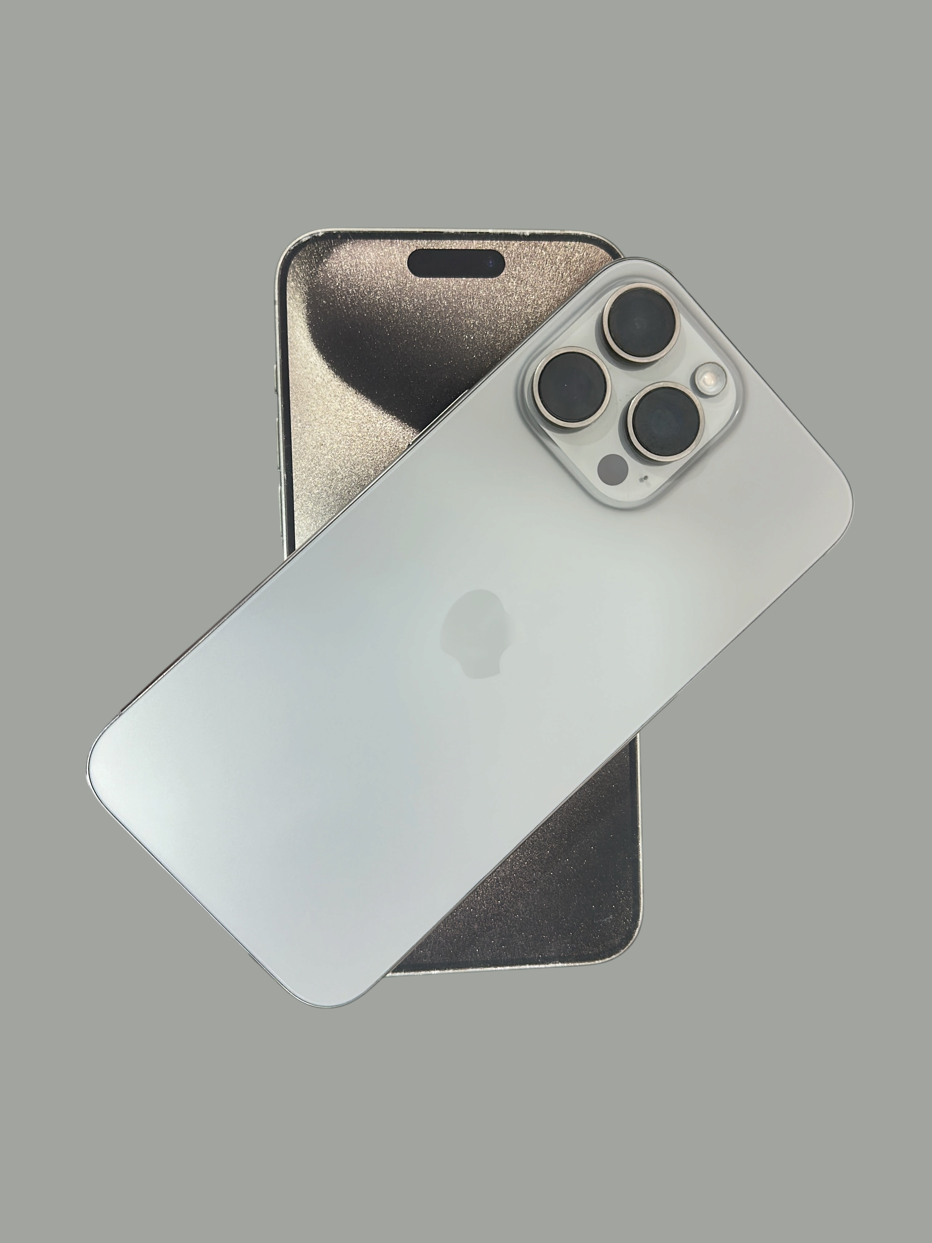 Iphoneio Official premium smartphone in silver with a triple-camera system, shown with its original packaging.