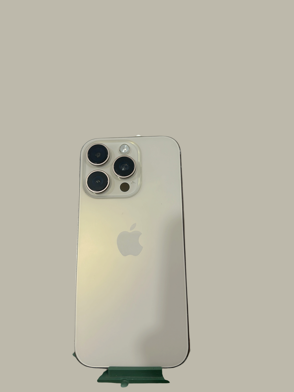 Iphoneio Official premium smartphone in silver with a triple-lens camera system on a black background