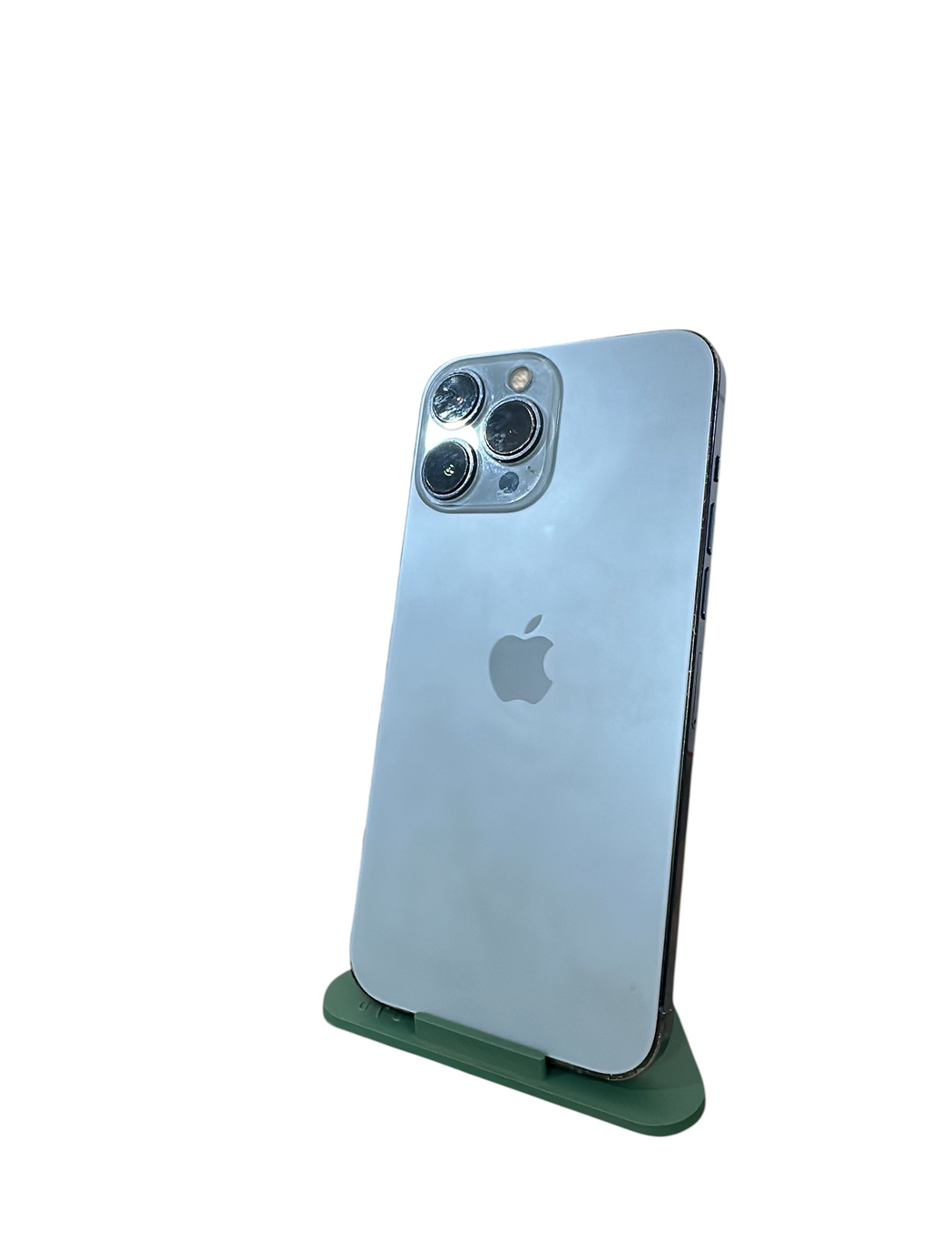 Iphoneio Official premium smartphone with a silver glass back and triple-lens camera system on a green stand.