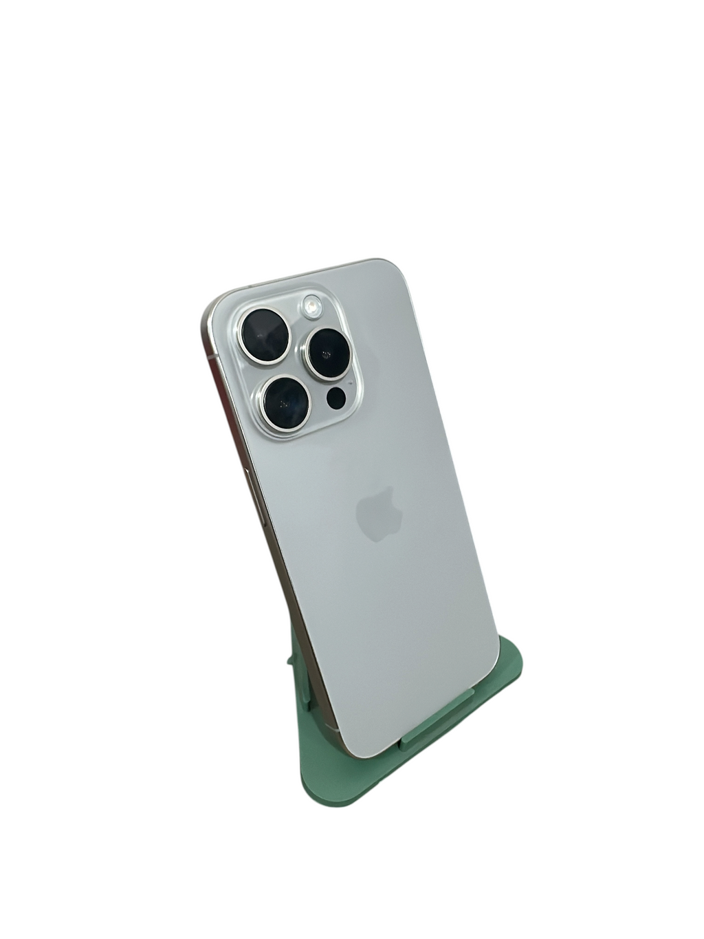 Iphoneio Official premium smartphone in silver with a triple-lens camera system, displayed on a green stand.
