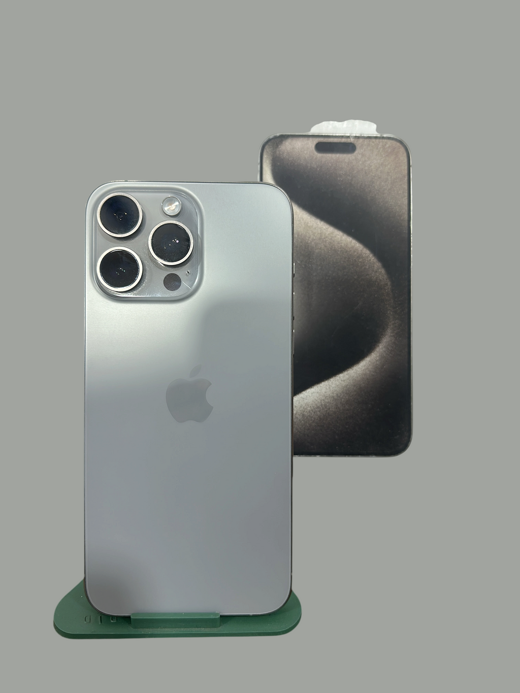 Iphoneio Official premium smartphone with titanium frame and triple-camera system, shown with original packaging box.