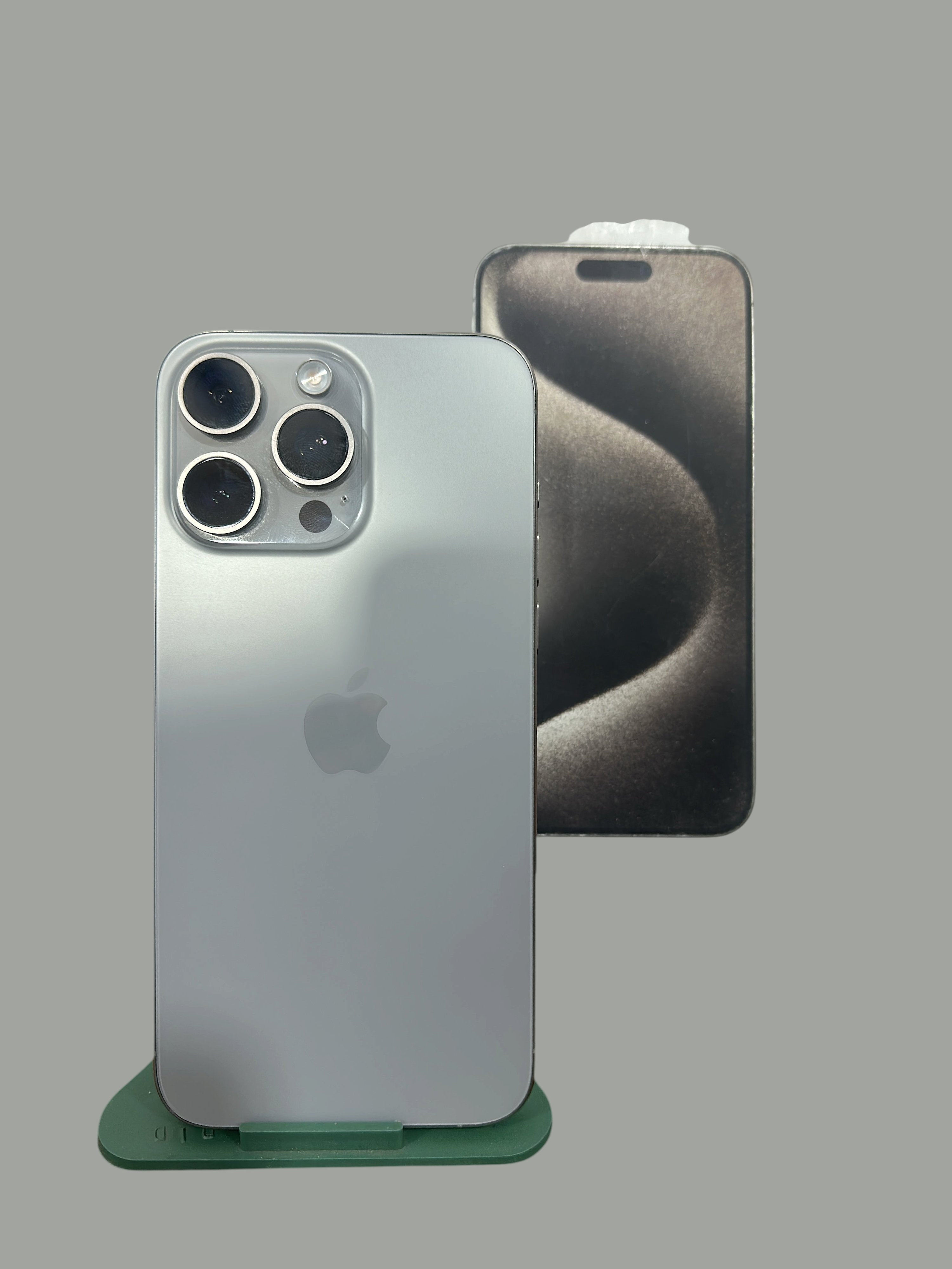 Iphoneio Official premium smartphone with titanium frame and triple-camera system, shown with original packaging box.