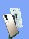 Iphoneio Official vivo Y400 Pro 5G smartphone in a premium gold finish with its retail box on a black background
