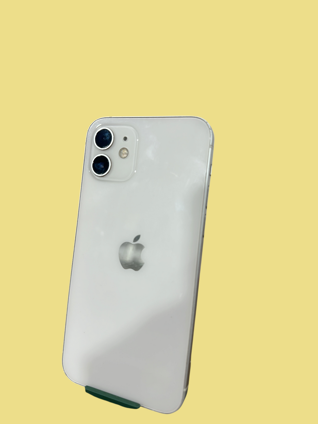Iphoneio Official white Apple iPhone 12 smartphone showing the dual-camera system and sleek glass back design