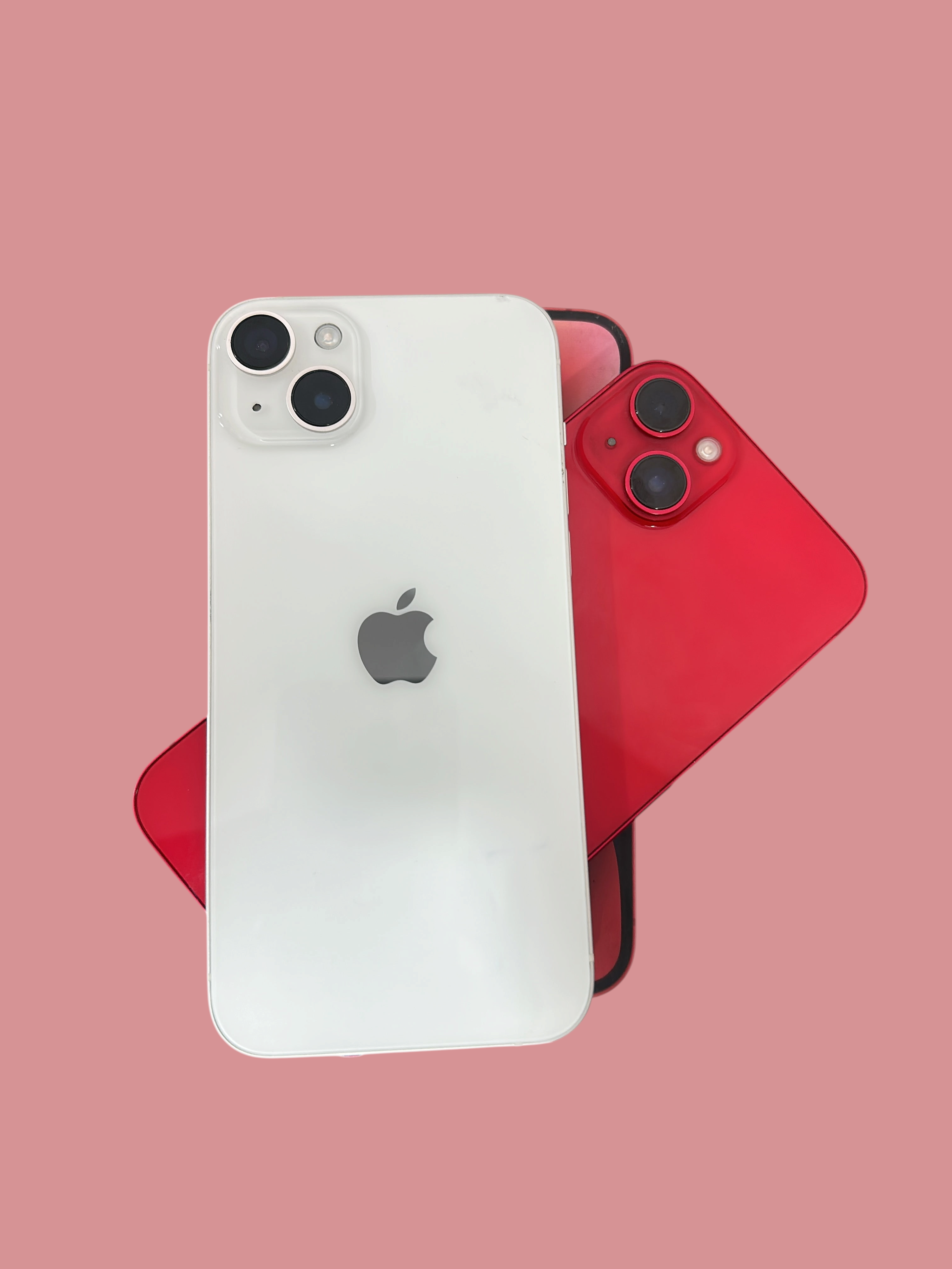 Iphoneio Official white and red Apple iPhone smartphones with dual-camera systems stacked on their product boxes.