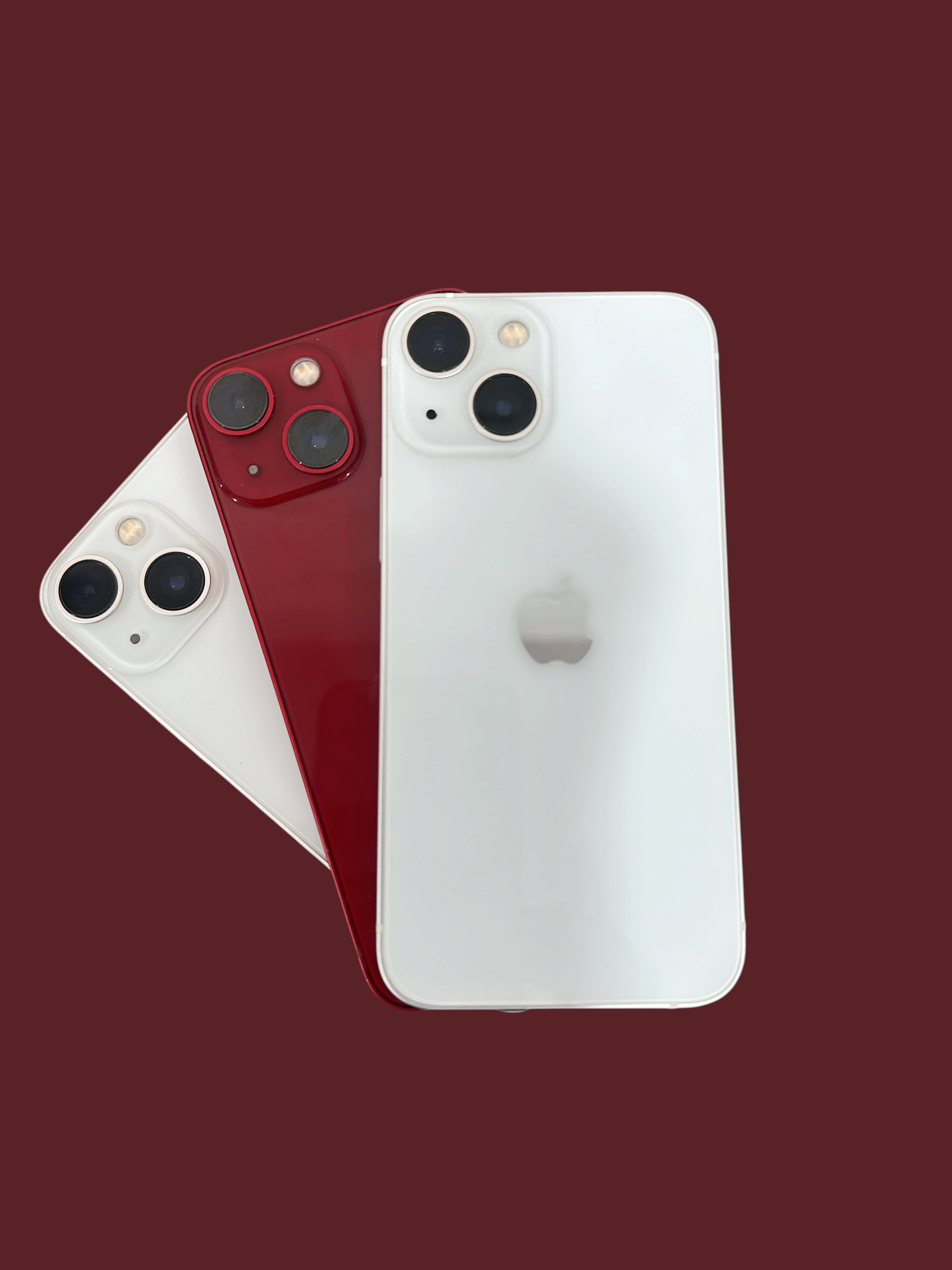 Iphoneio Official premium smartphones in white and red with dual-camera systems and sleek glass back designs.