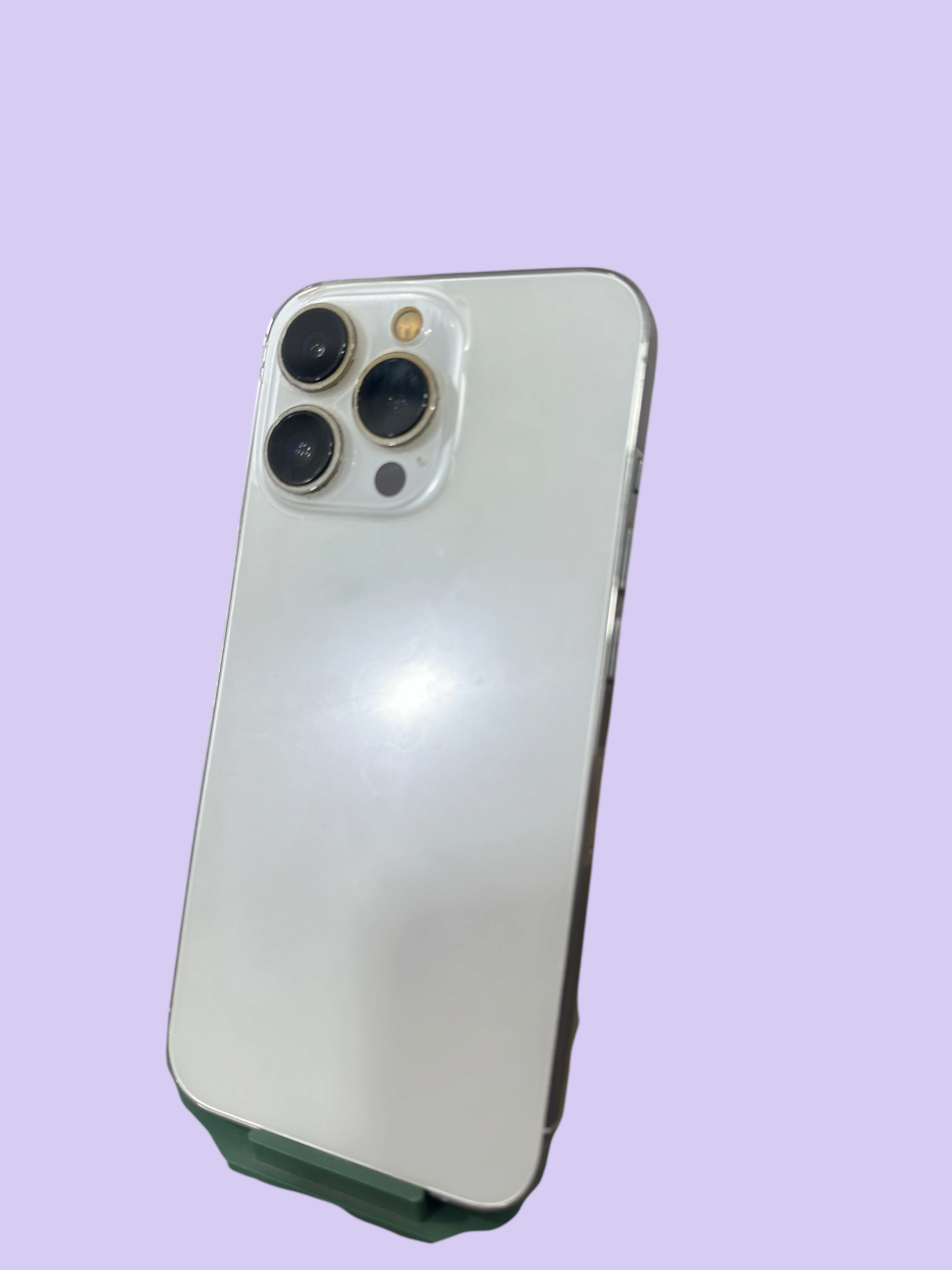 Iphoneio Official premium white smartphone with a triple-camera system and sleek glass back design