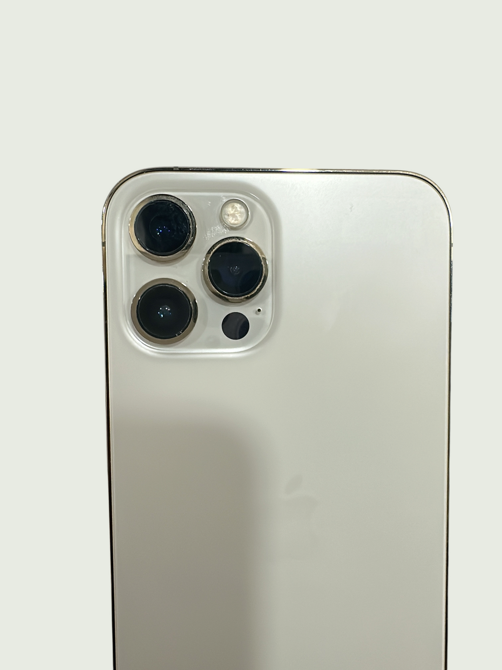 Iphoneio Official premium smartphone in white with a professional-grade triple-lens camera system and metallic frame.